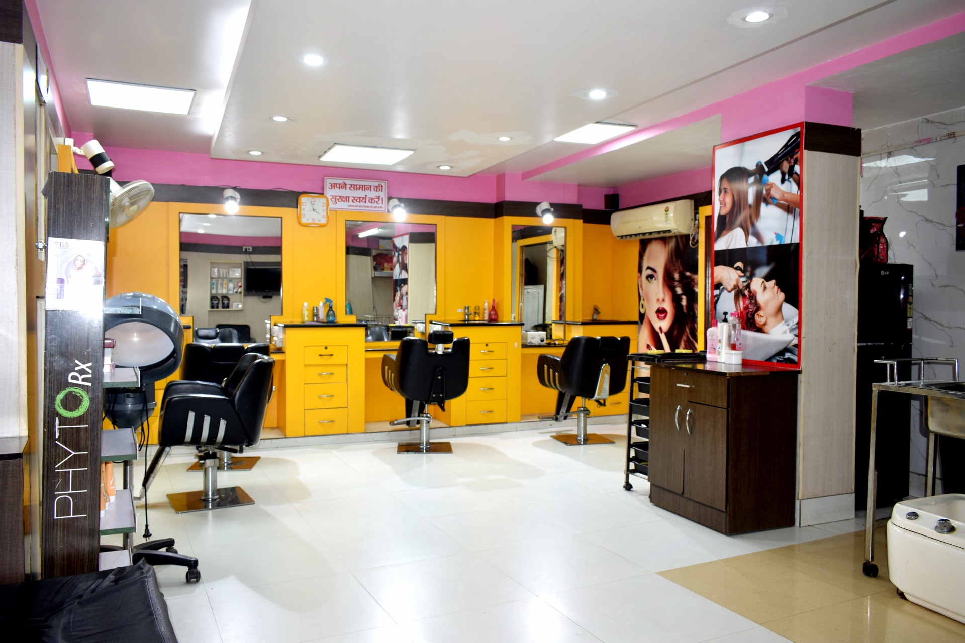 Fully equipped salon floor with styling chairs, hair spa equipment and mirrors