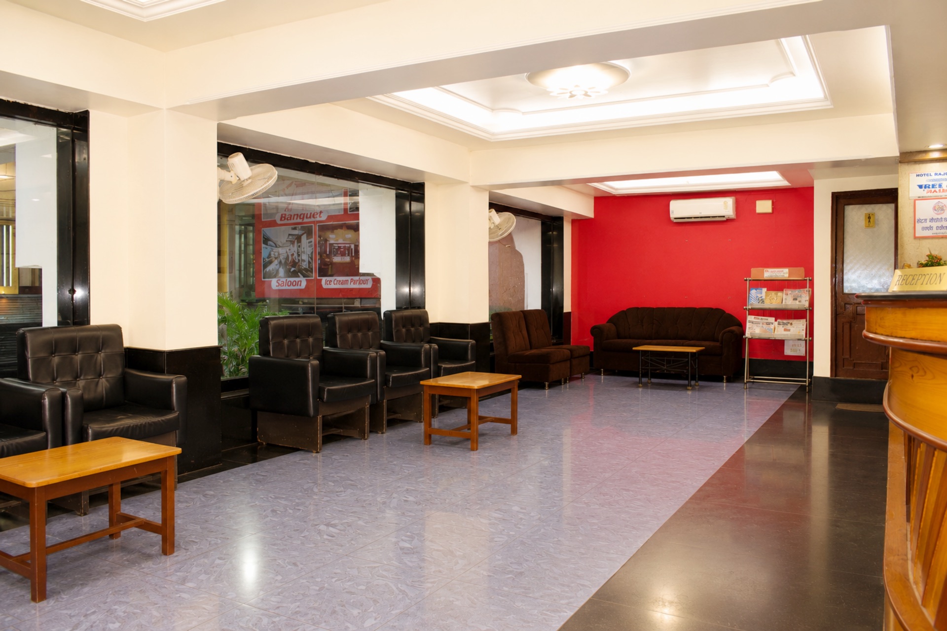 Spacious main hotel lobby hall with visitor seating and reception counter