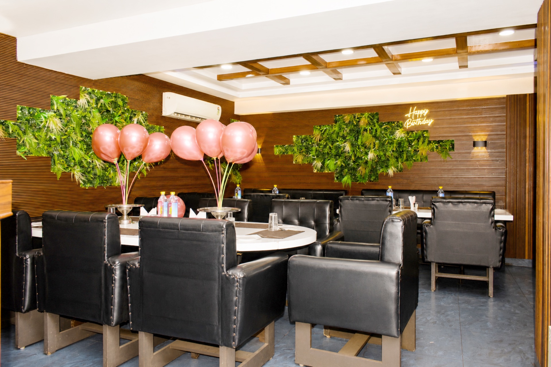 Takshshila Restaurant celebration table setup with balloon decor