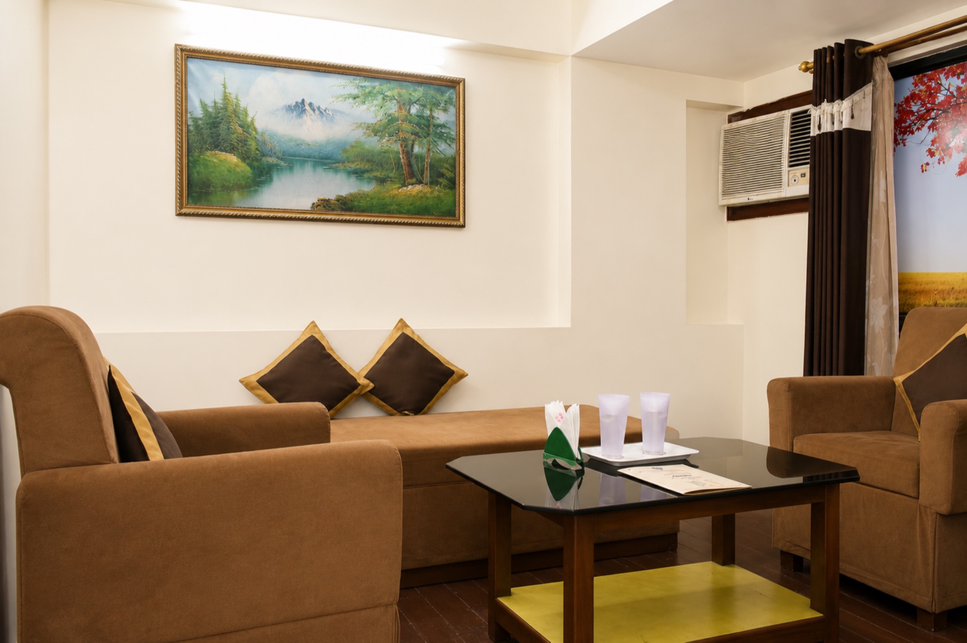 Royal Suite private living lounge with comfortable armchairs and wall artwork